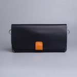 Carry on leather wallet with shoulder strap in black in Pakistan.