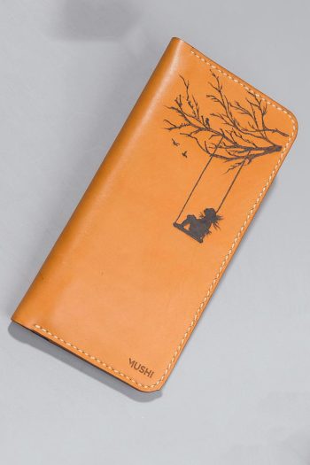 Imported genuine long leather wallet in beige with girl on a swing painting in Pakistan.