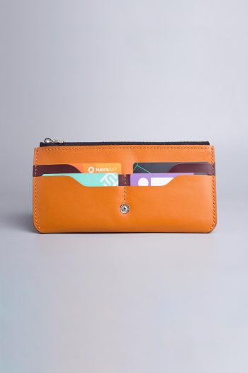 Carry on leather wallet with shoulder strap in beige in Pakistan.