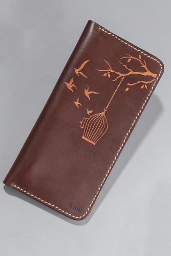 Imported genuine long leather wallet in burgundy with birds flying out of a cage painting in Pakistan.