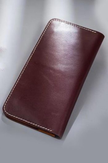 Imported genuine long leather wallet in burgundy with birds flying out of a cage painting in Pakistan.