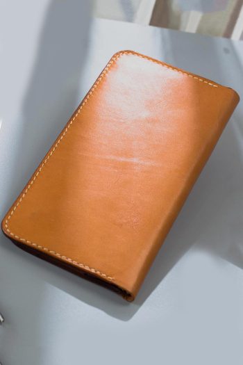 Imported genuine long leather wallet in beige with bicycle rider painting in Pakistan.