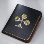 Black vegetable-tanned leather with a club abstract design.