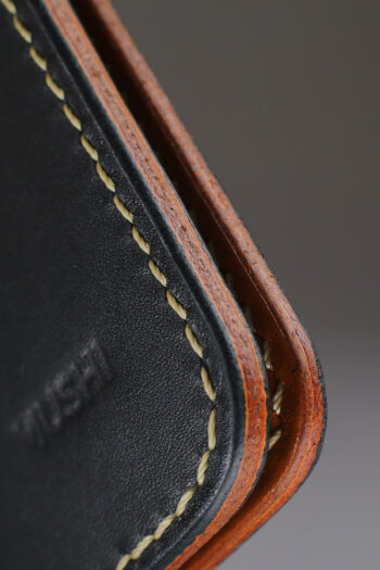 Black vegetable-tanned leather with a club abstract design.