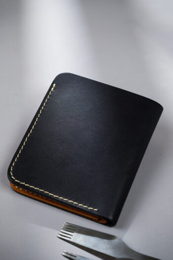 Black vegetable-tanned leather with a club abstract design.