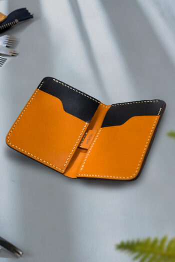 Black vegetable-tanned leather with a club abstract design.