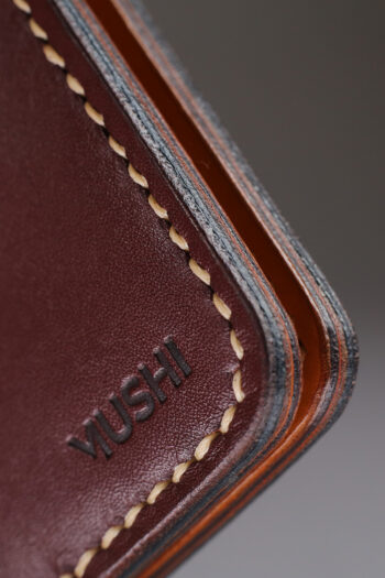 Burgundy vegetable-tanned leather with a diamond abstract design.