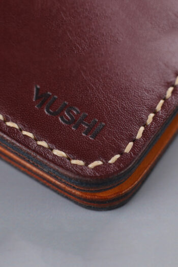 Burgundy vegetable-tanned leather with a diamond abstract design.