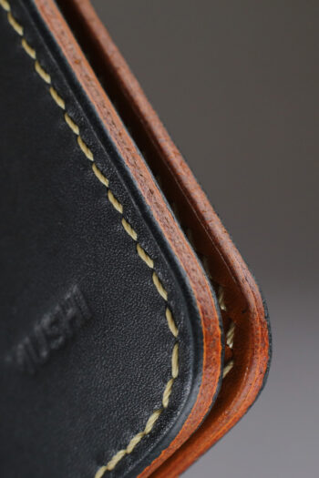 Genuine minimalist leather wallet with pull-out strap in black with fierce leopard painting in Pakistan.