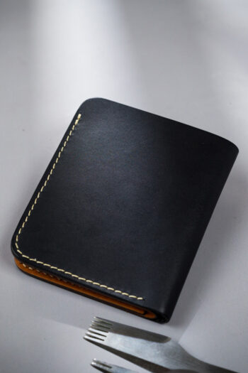 Genuine minimalist leather wallet with pull-out strap in black with fierce leopard painting in Pakistan.