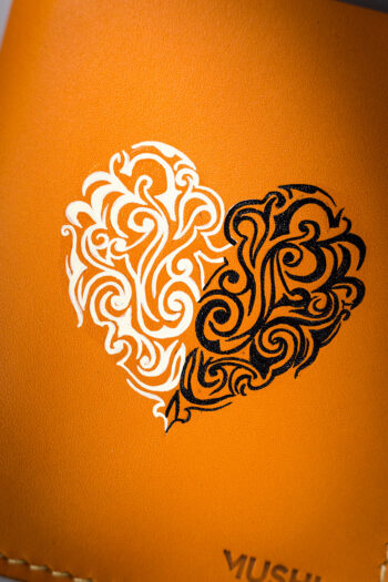 Beige vegetable-tanned leather with a heart abstract design.