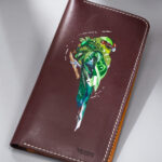 Imported genuine long leather wallet in burgundy with green parrot painting in Pakistan.