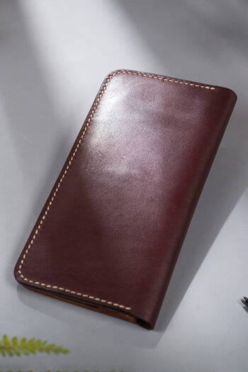 Imported genuine long leather wallet in burgundy with green parrot painting in Pakistan.