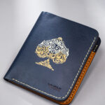 Navy vegetable-tanned leather with a spade abstract design.