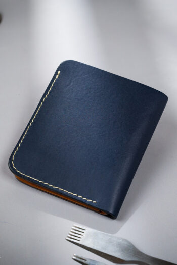 Navy vegetable-tanned leather with a spade abstract design.
