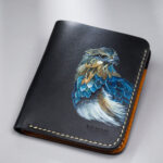 Genuine minimalist leather wallet with pull-out strap in black with eagle painting in Pakistan.