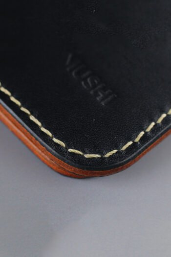 Genuine minimalist leather wallet with pull-out strap in black with eagle painting in Pakistan.