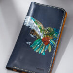 Imported genuine long leather wallet in black with colourful bird illustration in Pakistan