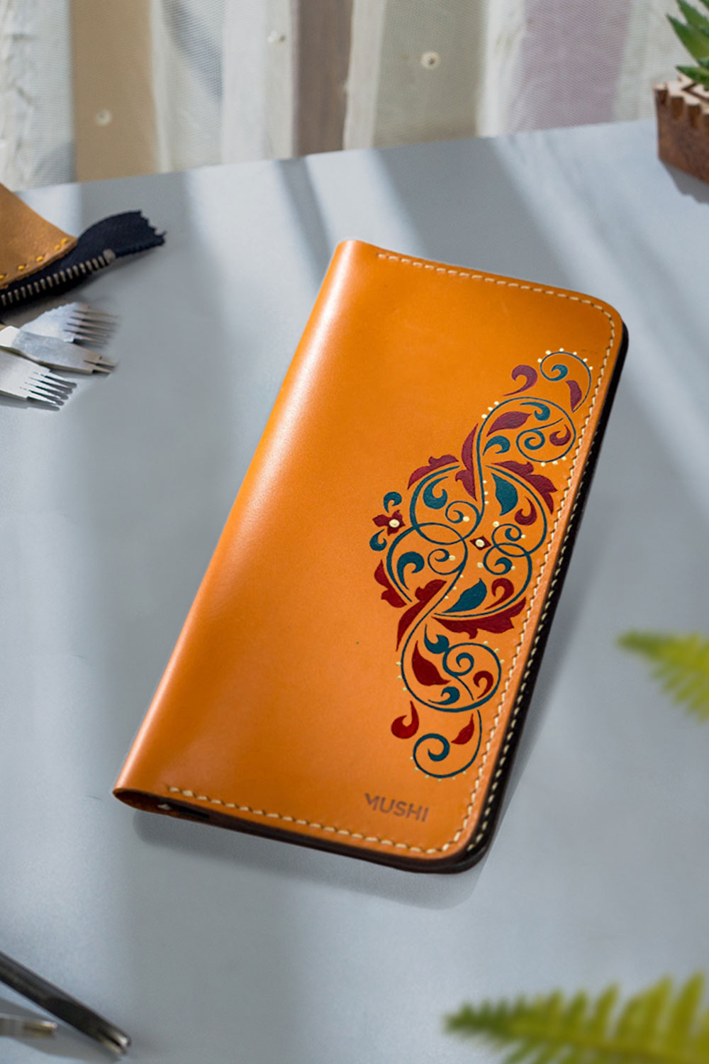 Long orange wallet cultural art on side of wallet