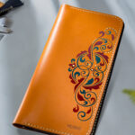 Hand-painted leather wallet with cultural design for women in Pakistan.