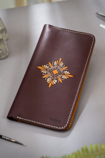 Elegant long leather wallet with center motif design