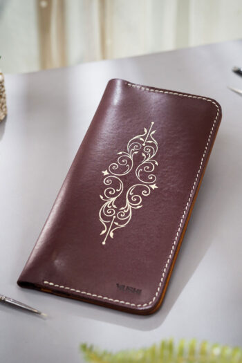 Minimalist burgundy leather wallet for women with single-tone motif by MUSHI