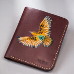 Hand-painted black leather wallet with tan bird art, handcrafted by MUSHI.