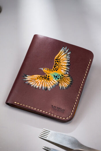 Hand-painted black leather wallet with tan bird art, handcrafted by MUSHI.